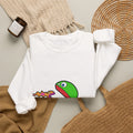 White JimBob Schnerd Crewneck Sweatshirt, styled on a table with the character print visible